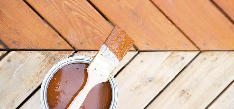 Wood Deck with Stain on it and Paint Brush